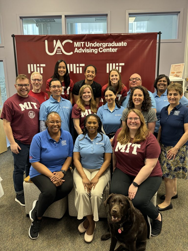 The UAC team posing in their office.